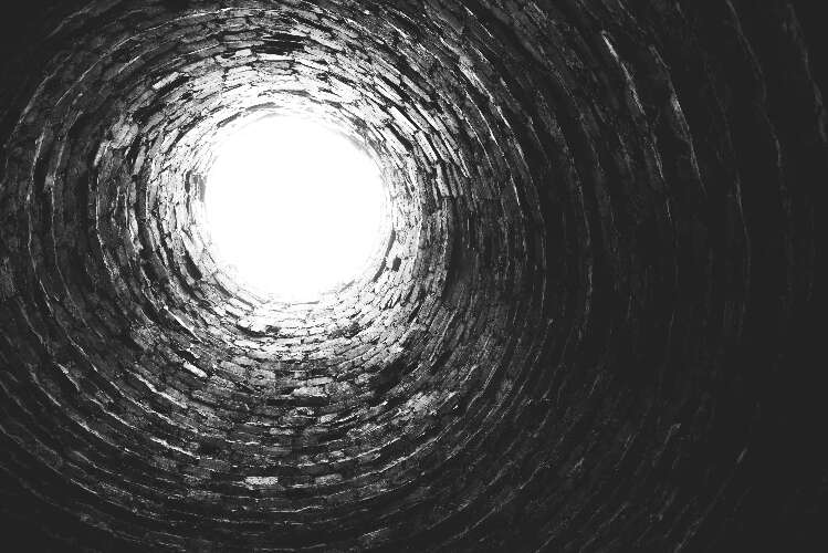 To be in a deep prison pit